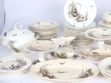 a lot of plates and bowls that are on a table