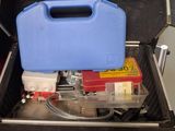 a blue case with tools inside of it on a table