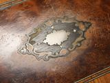 a wooden table with a decorative design on it