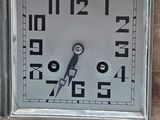 a clock that is on the side of a brick wall