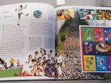 an open book with pictures of soccer players on it