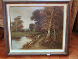 tableau représentant un paysage avec une rivière et des arbres, dans un cadre