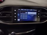 the dashboard of a car with a digital display in the center of it