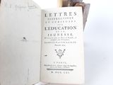 an open book with writing on it sitting on a table