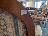many chairs that are in a room with a carpet on the floor