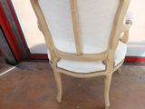 a chair that is sitting in front of a glass door