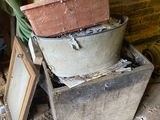 pots and pans are stacked on top of each other in a room