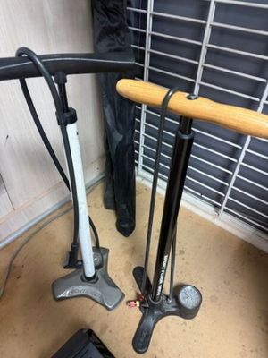 two bikes that are sitting on the floor next to each other