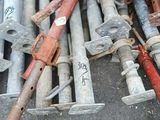 a pile of old rusty pipes and bolts on the ground