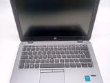 a laptop computer that is sitting on a white table