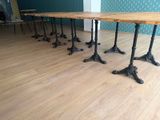 four tables that are sitting on the floor in the room