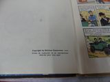 an open book with a picture of a man driving a car