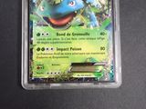 an image of a pokemon card with a blue and green pokemon character