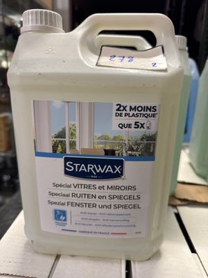 un gallon de Starwax posé sur une table