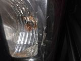 a close up of a car ' s tail light with a blurry background