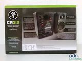 the box is open to show the contents of a computer speaker