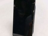a cell phone that is sitting on top of a stand