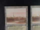 two cards that are sitting on a table