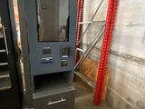 an image of a machine that is in a warehouse