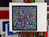 a picture of a painting on a easel in a room