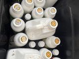 a lot of empty milk bottles in a black container