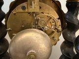 a close up of a clock on a table