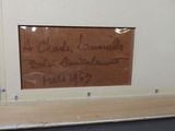 a picture of a sign on the wall of a bathroom