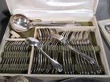 silverware in a box with spoons, forks and spoons on a table