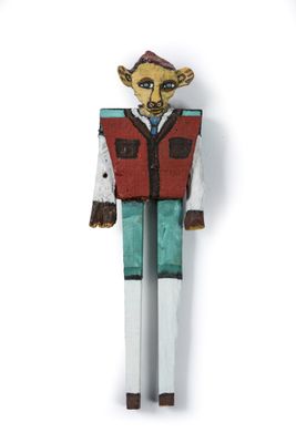 toy figurine of a man with a red vest and blue pants
