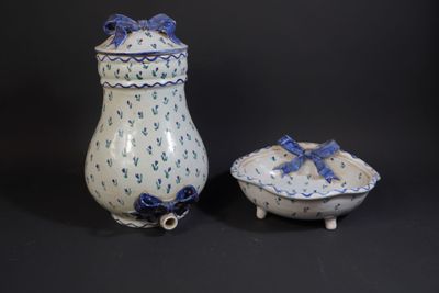 pair of blue and white vases with bows and bows on them
