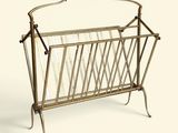 a metal magazine rack with a magazine holder on it