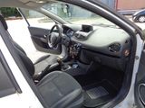 a car that is sitting in a parking lot with its door open