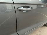 a close up of a car door handle with a sticker on it