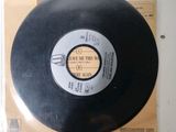 a record on the table with a price tag on it
