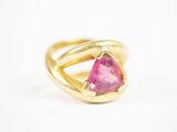 a close up of a gold ring with a pink tourmaline stone