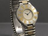 une montre-bracelet en argent et en or, ornée de chiffres romains