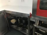 pots and pans on the counter in the kitchen