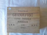 a wooden box with a label on it that says chateau grandefort