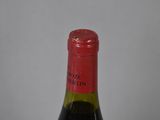 a bottle of wine that is sitting on a table