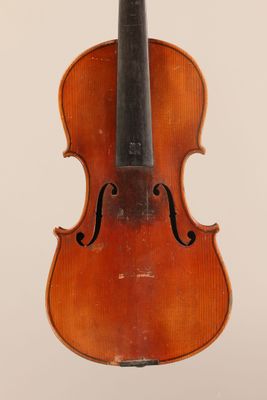 an old violin with a bow on a white background