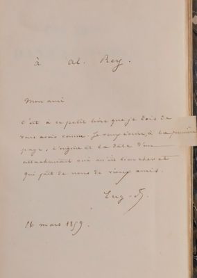 a close up of a book with a handwritten letter on it