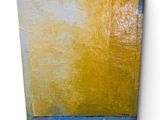 a painting of a yellow and blue painting on a white wall