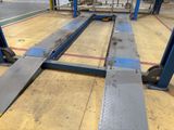 a picture of a fork lift in a warehouse